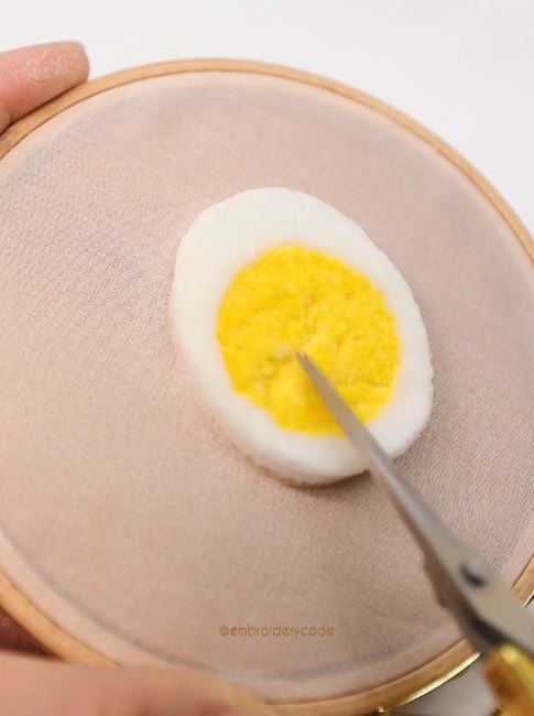 Nope, it’s actually a punch needle masterpiece of a boiled egg.