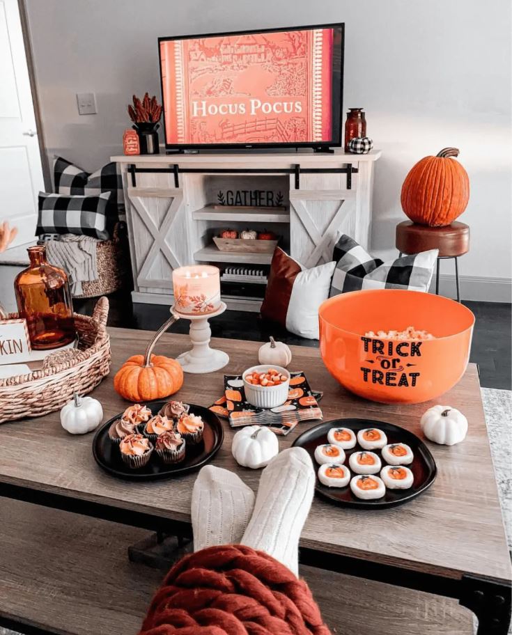 Still Halloween movie night but with streaming services and fancy snacks.