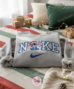 Sweet Stitch Candy Cane Santa Hat Embroidered Hoodie, Merry Stitchmas Disney Holiday Sweatshirt, Festive Christmas Snacks Apparel, Gift for Him Her 1 Sweet Stitch Candy Cane Santa Hat Embroidered Hoodie, Merry Stitchmas Disney Holiday Sweatshirt, Festive Christmas Snacks Apparel, Gift for H (3)