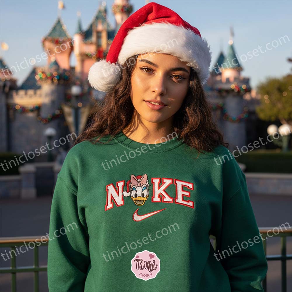 Christmas Daisy Duck Embroidered Sweatshirt, Santa Duck Disney Holiday Shirt, Custom Nike Inspired Xmas Hoodie, Disney Character Christmas Embroidered Apparel Christmas Daisy Duck Embroidered Sweatshirt, Santa Duck Disney Holiday Shirt, Custom Nike Inspired Xmas Hoodie, Disney Character Christmas Embroidered Apparel