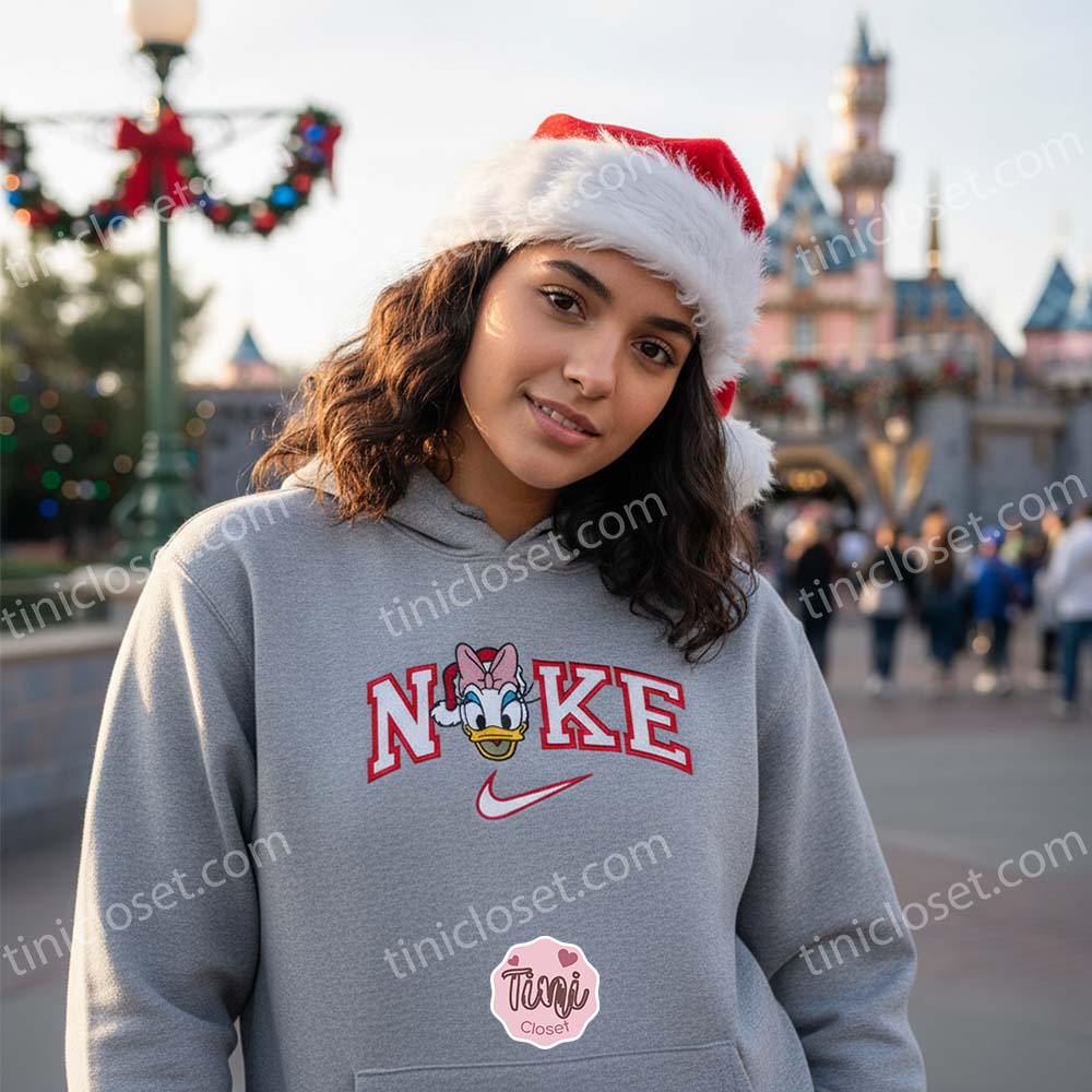 Christmas Daisy Duck Embroidered Sweatshirt, Santa Duck Disney Holiday Shirt, Custom Nike Inspired Xmas Hoodie, Disney Character Christmas Embroidered Apparel Christmas Daisy Duck Embroidered Sweatshirt, Santa Duck Disney Holiday Shirt, Custom Nike Inspired Xmas Hoodie, Disney Character Christmas Embroidered Apparel