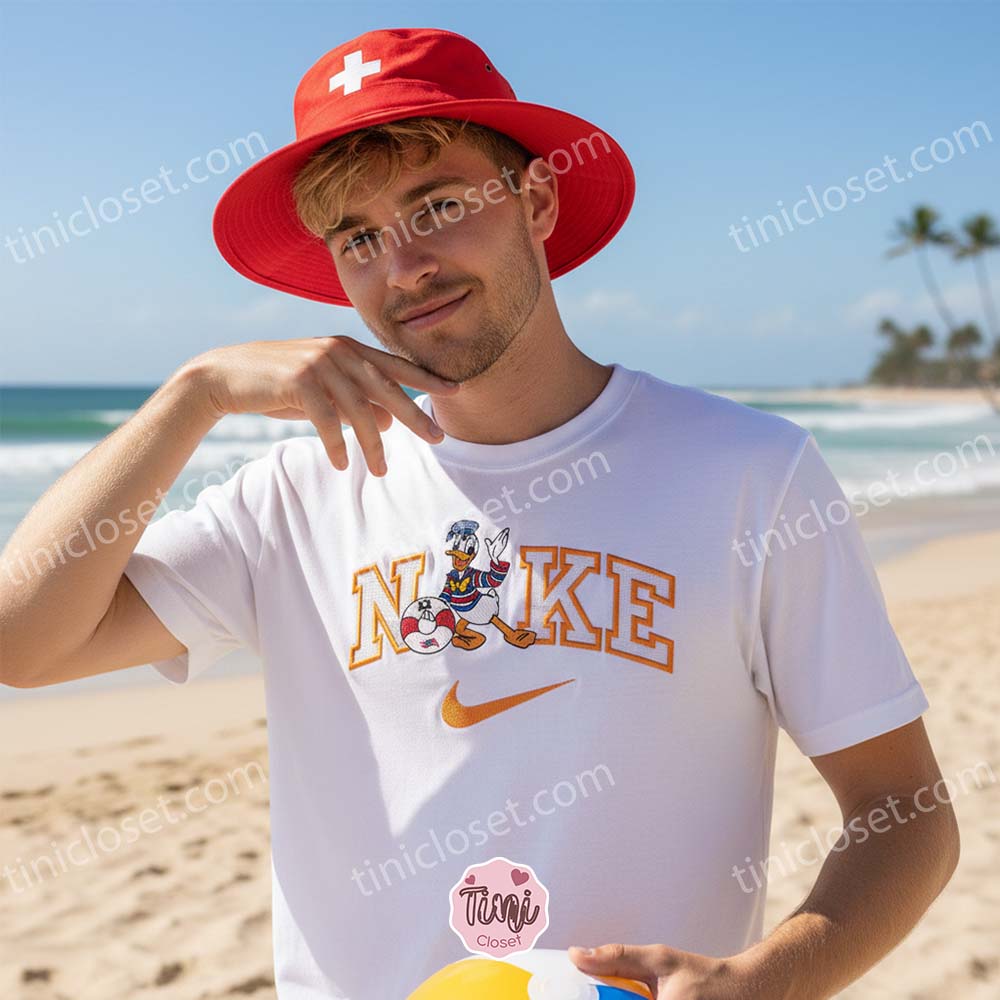 Donald Duck Lifeguard Embroidered Shirt, Disney Character Summer Career Apparel, Custom Nike Inspired Beach Guard Hoodie, Funny Cartoon Lifeguard Sweatshirt Donald Duck Lifeguard Embroidered Shirt, Disney Character Summer Career Apparel, Custom Nike Inspired Beach Guard Hoodie, Funny Cartoon Lifeguard Sweatshirt