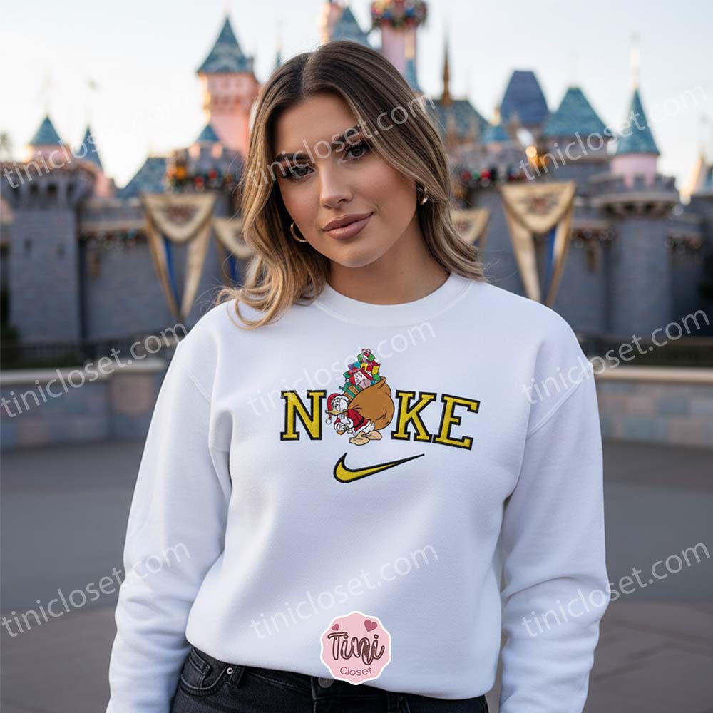 Embroidered Donald Duck Christmas Sweatshirt, Retro Holiday Cartoon Crewneck, Funny Santa Sack Graphic, Boyfriend Hoodie Gift Embroidered Donald Duck Christmas Sweatshirt, Retro Holiday Cartoon Crewneck, Funny Santa Sack Graphic, Boyfriend Hoodie Gift
