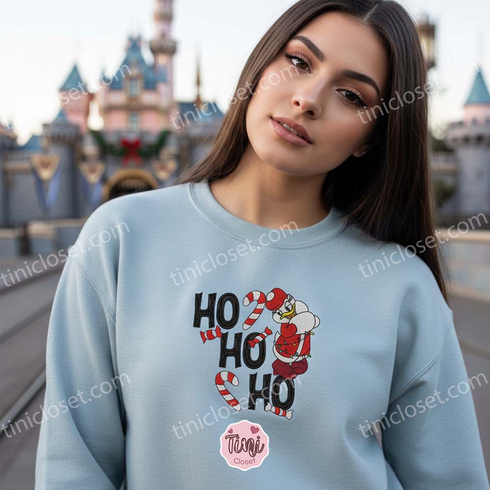 Embroidered Ho Ho Ho Christmas Daisy Duck Sweatshirt, Festive Holiday Crewneck & Hoodie, Cozy Gifts For Friends Embroidered Ho Ho Ho Christmas Daisy Duck Sweatshirt, Festive Holiday Crewneck & Hoodie, Cozy Gifts For Friends