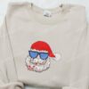 Santa Wearing Sunglasses Eating Candy Cane Embroidered Shirt, Retro Christmas Embroidered Hoodie, Best Gifts For Family
