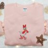 Daisy Duck Wearing Christmas Pajama Embroidered Shirt, Disney Characters Embroidered Hoodie, Christmas Embroidered Sweatshirt