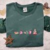 Kirby Eating Christmas Tree Cake Embroidered Shirt, Game Character Embroidered Hoodie, Christmas Embroidered Sweatshirt