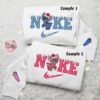 Stitch And Angel Xmas x Nike Couple Embroidered Shirt, Christmas Embroidered Hoodie, Valentine’s Day Embroidered Sweatshirt